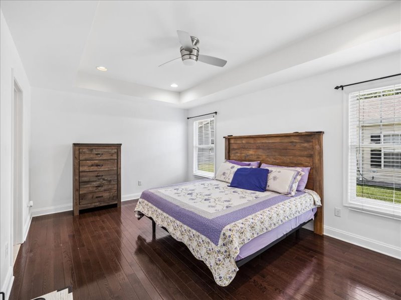 Primary bedroom with tray ceiling and hardwood floors at 134 Salt Creek Drive, Dover, Delaware