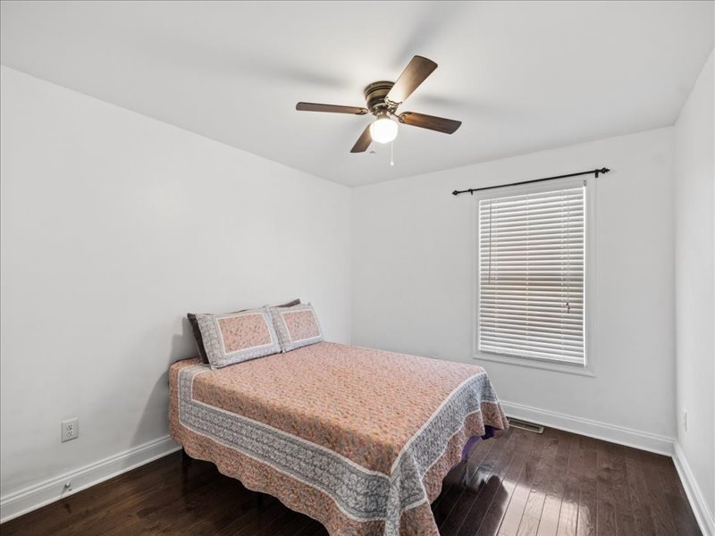 Guest bedroom with window and ceiling fan at 134 Salt Creek Drive, Dover, Delaware