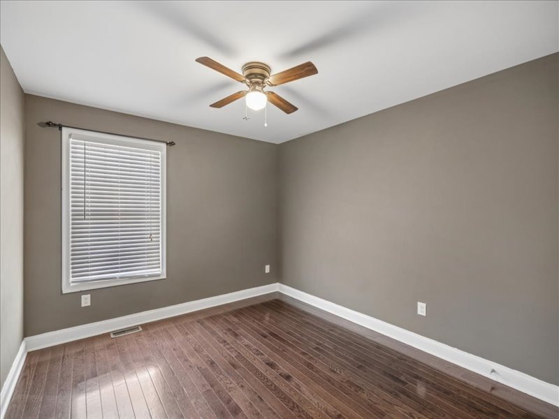 Bedroom with gray accent wall and ceiling fan at 134 Salt Creek Drive, Dover, Delaware