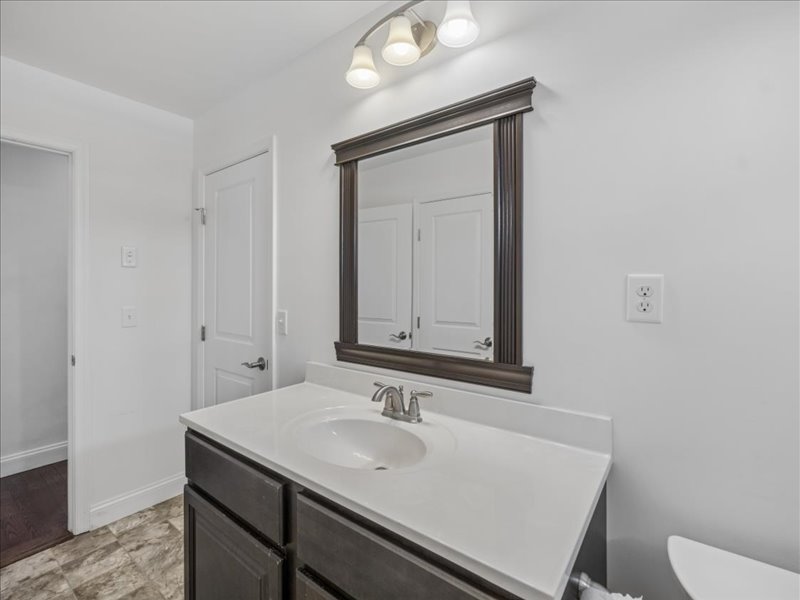 Bathroom vanity with framed mirror at 134 Salt Creek Drive, Dover, Delaware