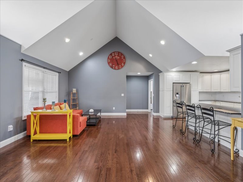 Living room open to the kitchen with vaulted ceiling at 134 Salt Creek Drive, Dover, Delaware