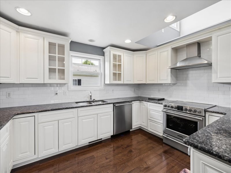 Kitchen with granite counters and stainless range at 134 Salt Creek Drive, Dover, Delaware