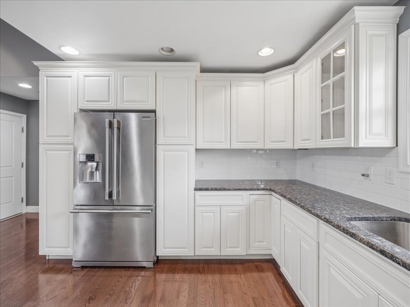 Kitchen cabinetry and stainless refrigerator at 134 Salt Creek Drive, Dover, Delaware