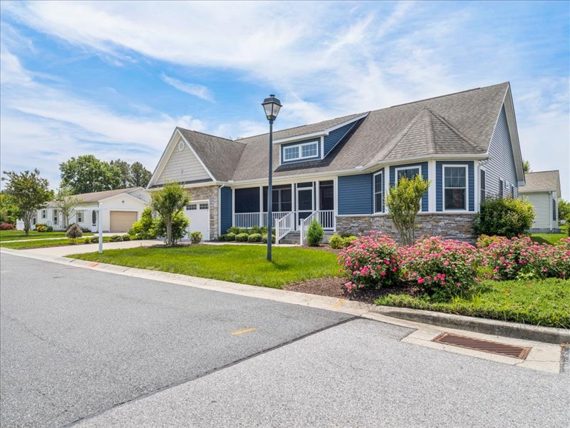 Street view of the home and landscaped corner lot at 134 Salt Creek Drive, Dover, Delaware