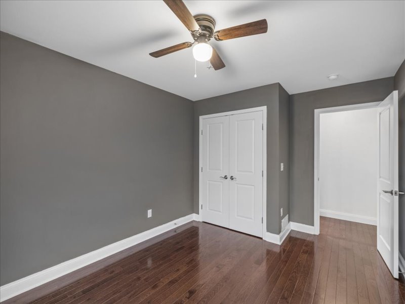Bedroom with double closet doors and hardwood floors at 134 Salt Creek Drive, Dover, Delaware