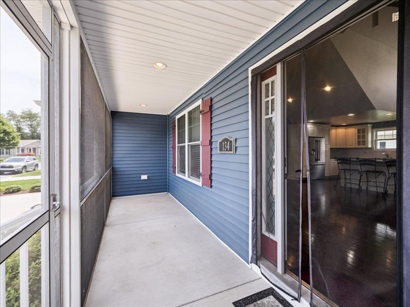 Covered rear porch overlooking the yard at 134 Salt Creek Drive, Dover, Delaware